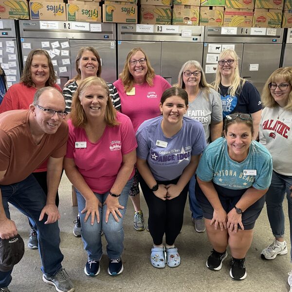 Members served food at the Partners for our Communities Food Pantry